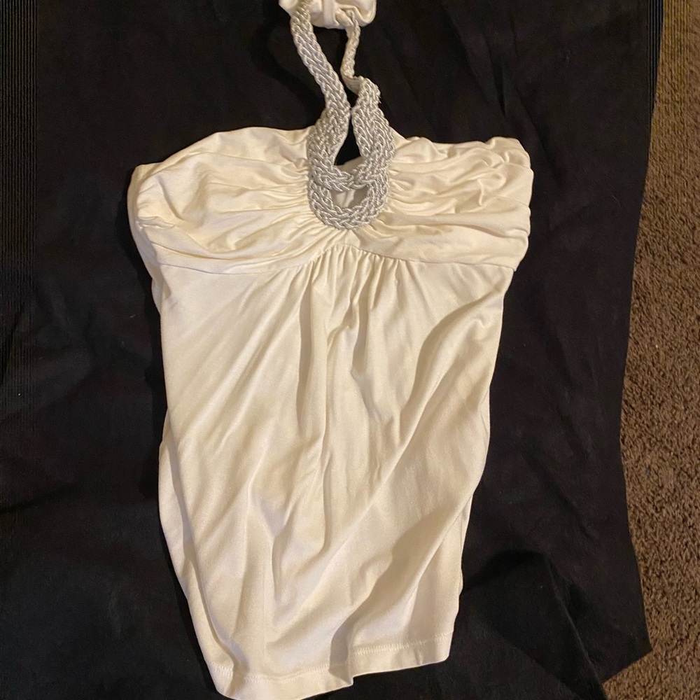 Halter top goes great w/ jeans and heels or dress up w/ pants or skirt.